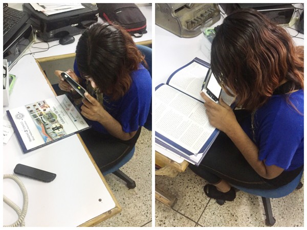 A person from Trinidad and Tobago Blind Welfare Association trying M5 HD Plus video magnifier