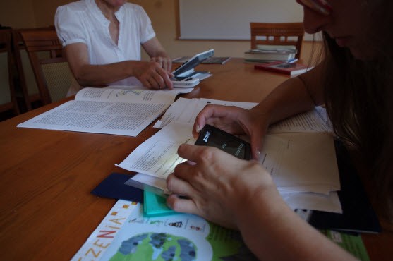 Polish Association of the Blind staff trying wide HD screen handheld video magnifier Butterfly