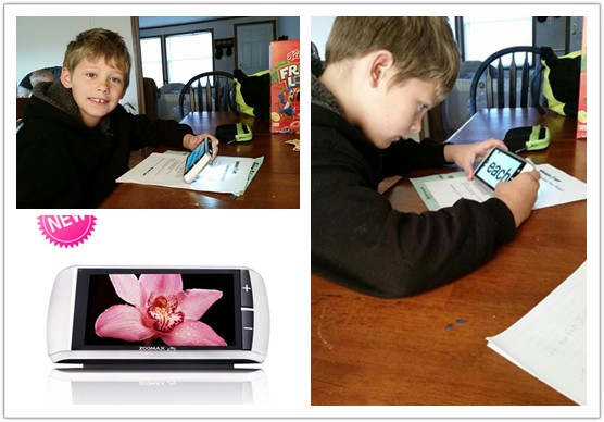 boy using Zoomax touch handheld video magnifier M5 to read and do homework